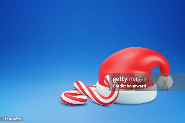 illustrazioni stock, clip art, cartoni animati e icone di tendenza di sfondo concettuale di natale 3d. cappello da babbo natale con bastoncini di zucchero. vettore - cappello babbo natale