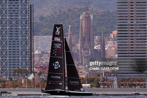 American Magic sails in front of the Sagrada Familia basilica and the Olympic Towers during the 37th America's Cup - Luis Vuitton semi-final race,...