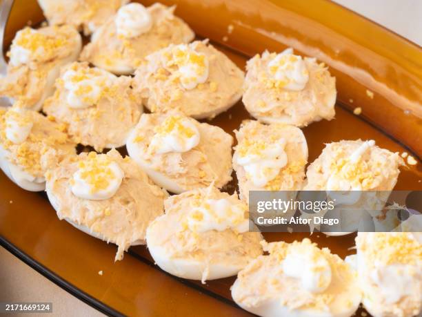 ready-to-eat tuna stuffed eggs with mayonnaise - deviled egg stock pictures, royalty-free photos & images