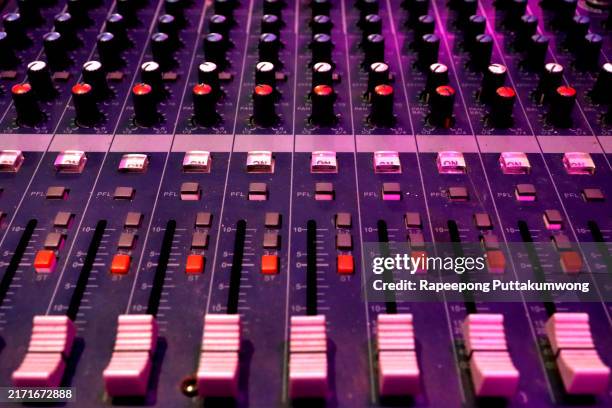 recording studio mixing desk with music producer - mengpaneel stockfoto's en -beelden
