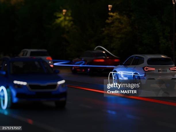 cars on road at night with light paths showing movement. cool sci-fi screne. - fühler stock-fotos und bilder