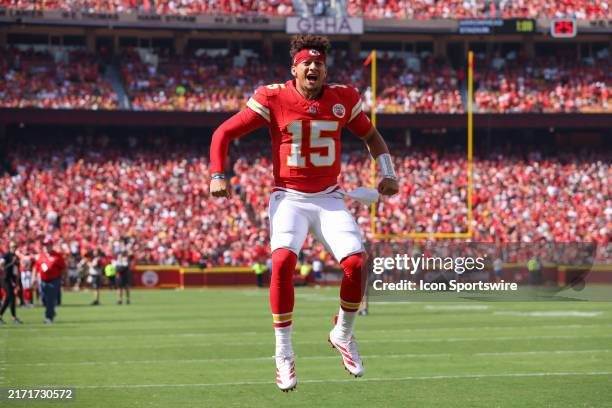 Kansas City Chiefs quarterback Patrick Mahomes leaps high and yells to fire up the crowd before an NFL game between the Cincinnati Bengals and Kansas...