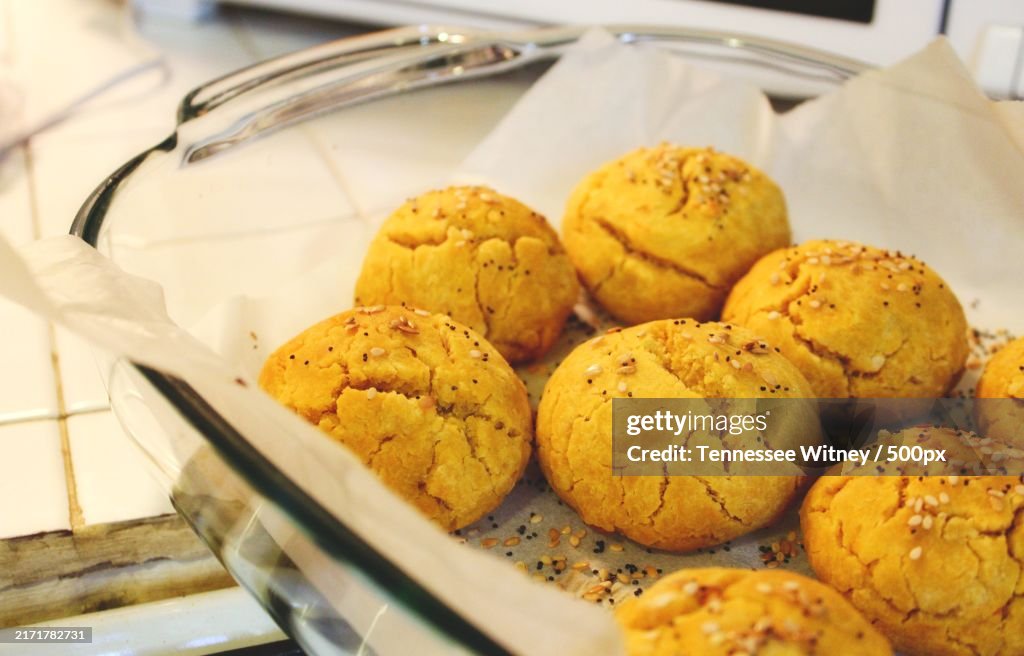 Sweet potato and pumpkin bread rolls freshly baked in a pyrex dish,United States,USA