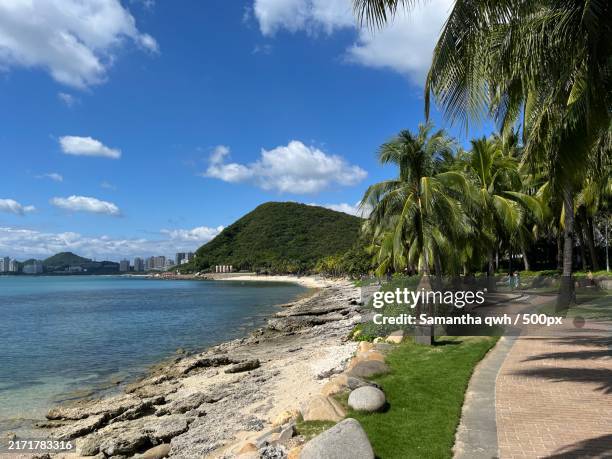 scenic view of beach against sky,sanya,hainan,china - sanya stock pictures, royalty-free photos & images