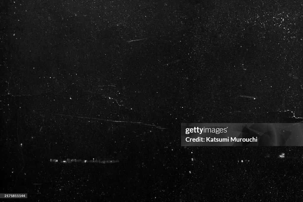 Scratched black wall texture abstract grunge background