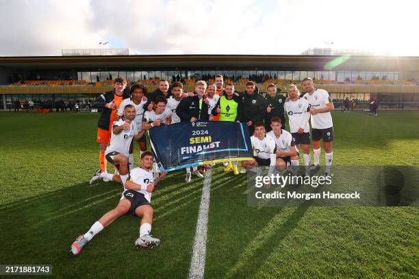 Macarthur FC players pose with the Semi Finalist banner following the 2024 Australia Cup Quarter Final match between Oakleigh Cannons and Macarthur...