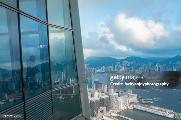 skyscraper view of the city at dusk, with magnificent reflections in the windows. hong kong's kowloon - central district hong kong stock pictures, royalty-free photos & images