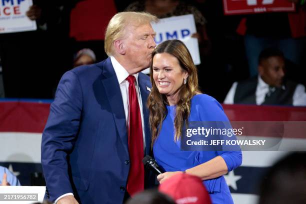 Former US President and Republican presidential candidate Donald Trump attends a town hall meeting moderated by Arkansas Governor Sarah Huckabee...