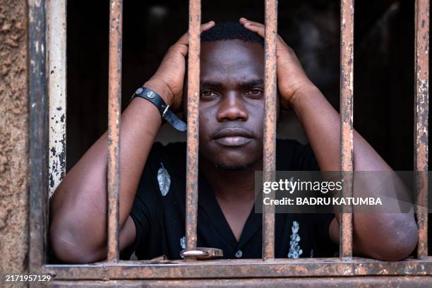 Ugandan Activist Abdulaziz Bweete a first-year student majoring in Community Development and Social Justice at Kyambogo University looks through his...