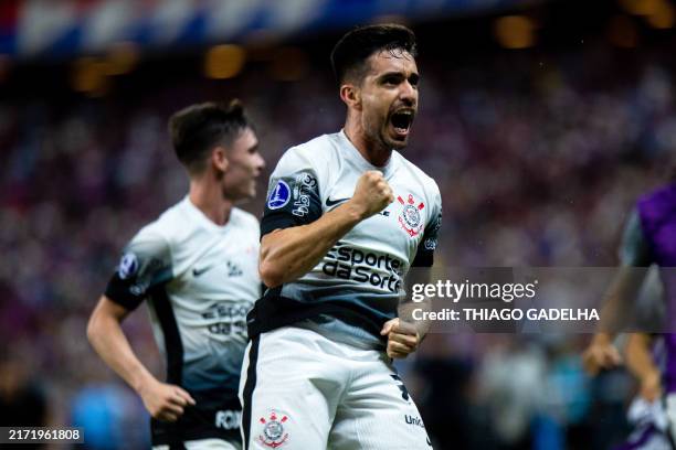 Corinthians' Italian midfielder Igor Coronado celebrates after scoring a goal during the Copa Sudamericana quarter-final first leg all-Brazilian...