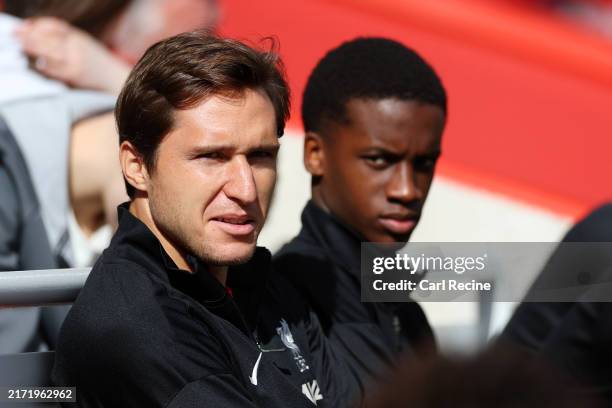 Federico Chiesa of Liverpool looks on from the bench during the Premier League match between Liverpool FC and Nottingham Forest FC at Anfield on...