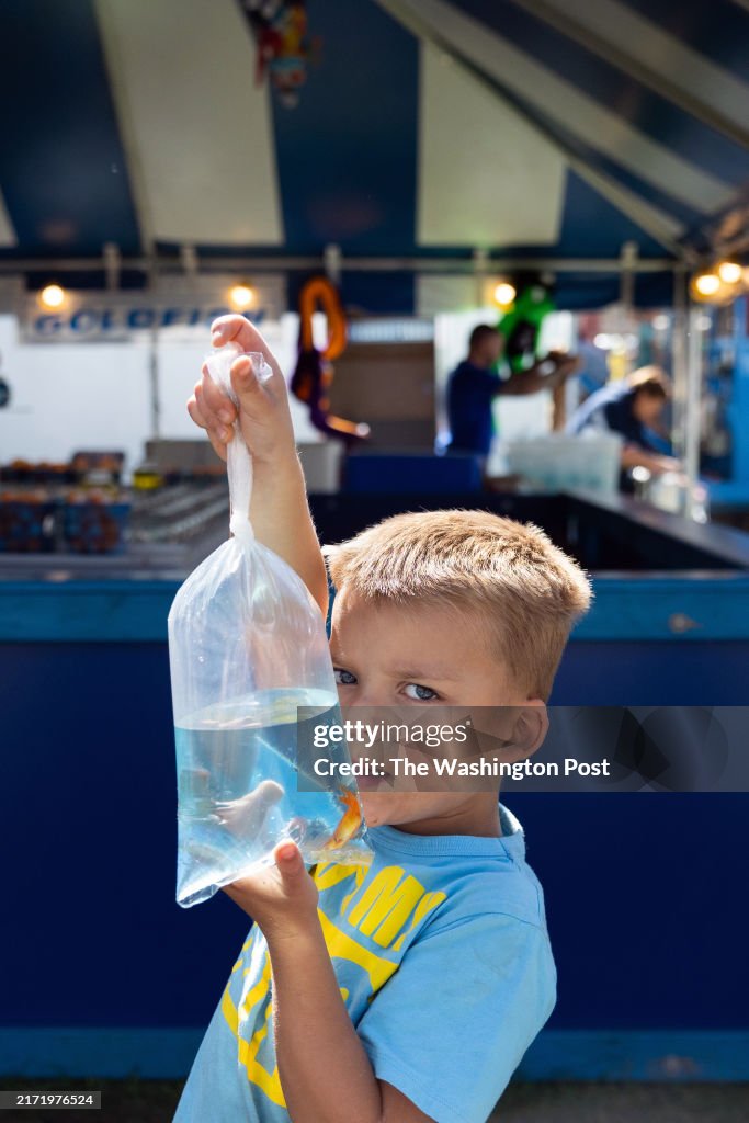 PALMERTON, PENNSYLVANIA - September 8: Jordan Curran, 5, embrac