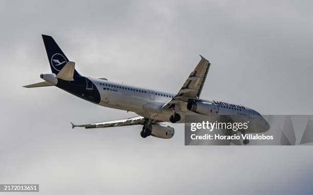 Lufthansa Airbus A321 aircraft flies over the city approaching to land in Humberto Delgado International Airport on September 14 in Lisbon, Portugal....