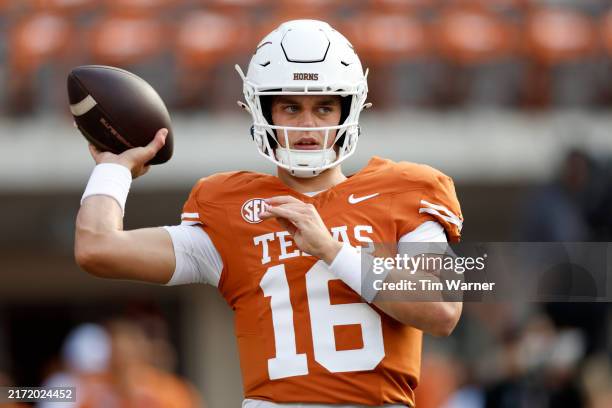 Arch Manning of the Texas Longhorns warms up before the game against the UTSA Roadrunners at Darrell K Royal-Texas Memorial Stadium on September 14,...