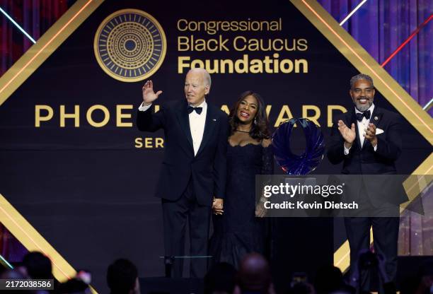 President Joe Biden is welcomed on stage by Congressional Black Caucus Foundation Board Chair, Rep. Terri Sewell and Congressional Black Caucus Chair...