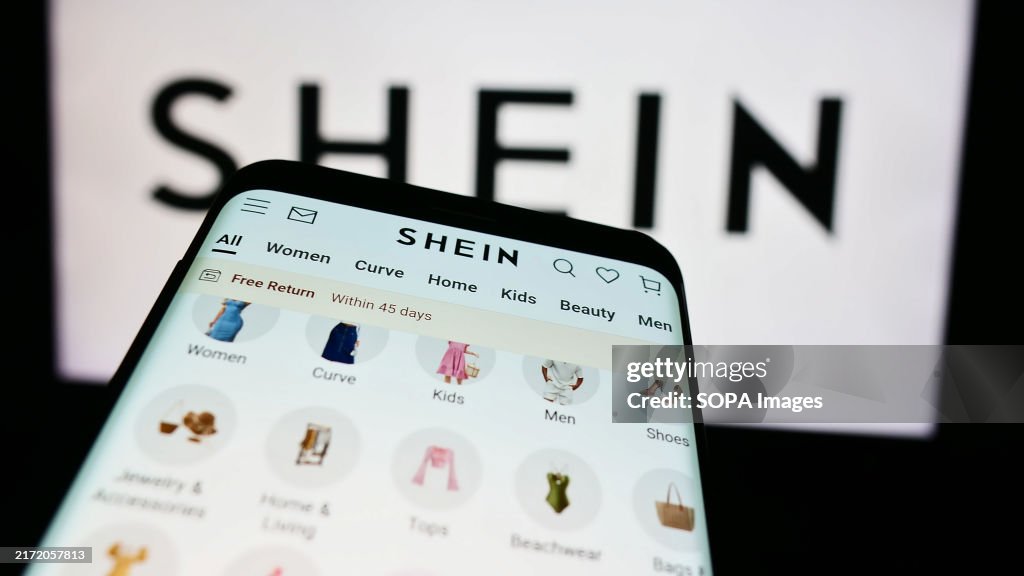 In this photo illustration, a smartphone with the website of...