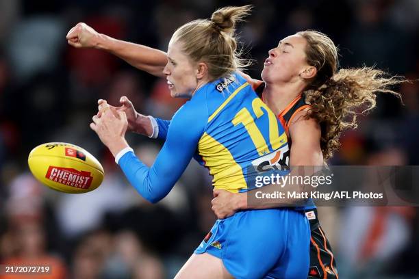 Tara Bohanna of the Suns is challenged by Tarni Evans of the Giants during the round three AFLW match between Greater Western Sydney Giants and Gold...