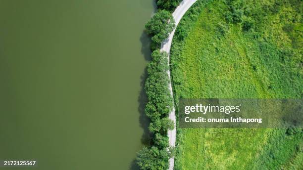aerial view of the rural road around the dam, reservoir beautiful natural landscape - green mountains rocky mountains stock pictures, royalty-free photos & images