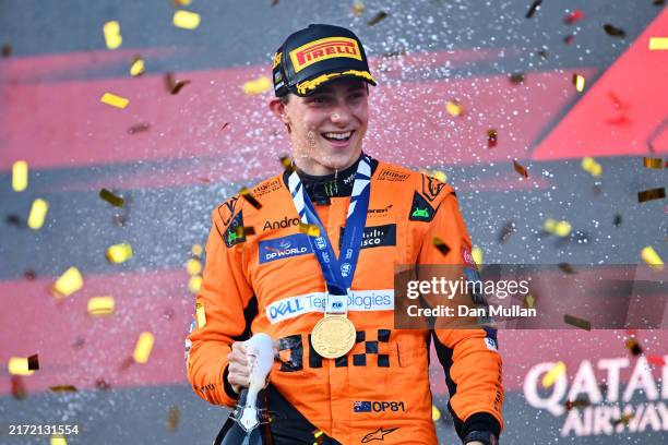 Race winner Oscar Piastri of Australia and McLaren celebrates on the podium during the F1 Grand Prix of Azerbaijan at Baku City Circuit on September...