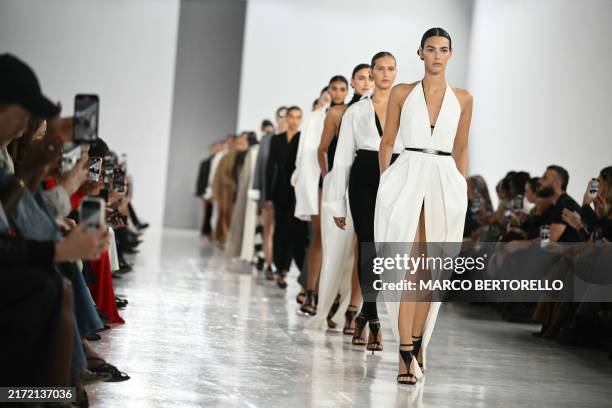 Models walk the runway during the Max Mara collection show at Milan's Fashion Week Womenswear Spring / Summer 2025, on September 19, 2024 in Milan.
