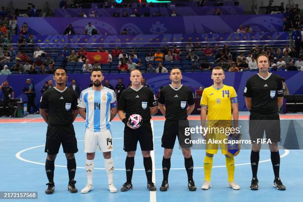 Referee Antony Riley and his assistants pose with Pablo Taborda of Argentina and Petro Shoturma of Ukraine prior to the FIFA Futsal World Cup...
