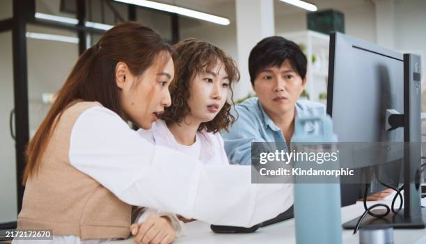 asian business people team brainstorm meeting work together in corporate office. discuss talk project planning strategy. generation z millennial businesspeople, sustainable workplace lifestyle concept - styrelse bildbanksfoton och bilder