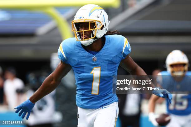 Quentin Johnston of the Los Angeles Chargers reacts after a touchdown reception during the first quarter against the Carolina Panthers at Bank of...