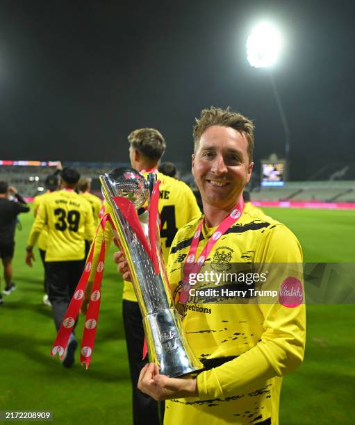 Tom Smith of Gloucestershire pose with the T20 Vitality Blast Trophy following the T20 Vitality Blast Final match between Somerset and...