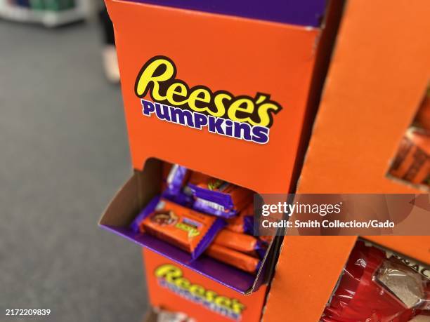 Close-up of a display stand featuring Reese's Pumpkins Halloween candy, Lafayette, California, September 9, 2024.