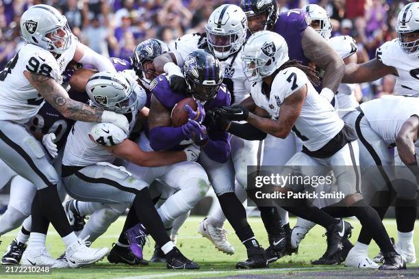 Derrick Henry of the Baltimore Ravens scores a touchdown during the fourth quarter against the Las Vegas Raiders at M&T Bank Stadium on September 15,...