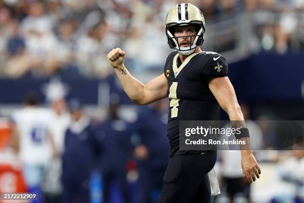 Derek Carr of the New Orleans Saints celebrates a touchdown pass during the third quarter against the Dallas Cowboys at AT&T Stadium on September 15,...