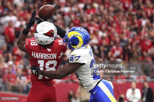 Marvin Harrison Jr. #18 of the Arizona Cardinals catches a touchdown pass in front of Tre'Davious White of the Los Angeles Rams during the first...