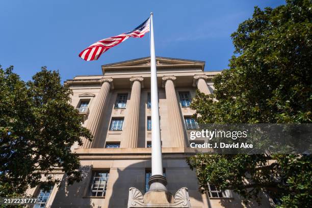 Flag flies in front of the U.S. Department of Justice headquarters building on September 15 in Washington, DC.
