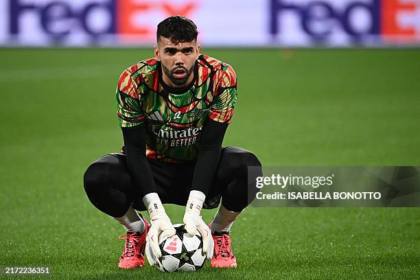 Arsenal's Spanish goalkeeper David Raya warms up prior to the UEFA Champions League 1st round day 1 football match between Atalanta Bergamo and...