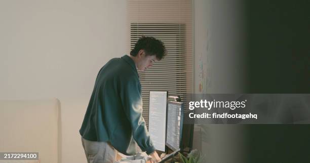 developer organizing project ideas on wall. - paper prototype stock pictures, royalty-free photos & images