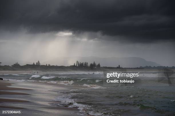 dramatic coastline at byron bay australia - rainy beach stock pictures, royalty-free photos & images