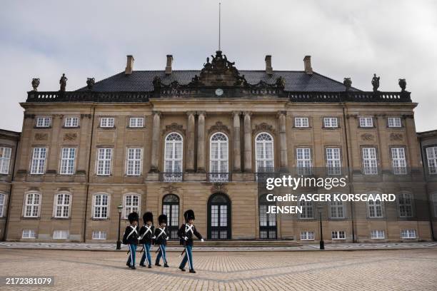 The Royal Guard are seen in front of the royal couple's residence, Frederik VIII's Palace at the Amalienborg Palace Square in Copenhagen, Denmark, on...