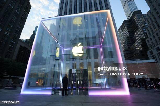 Customers wait outside for the new iPhone 16 and the Apple Watch Series 10 at the Fifth Avenue Apple Store on September 20, 2024 in New York City....
