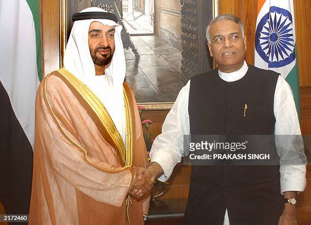 India's Minister for External Affairs Yashwant Sinha shakes hands with United Arab Emirates Armed Forces Chief of Staff Sheikh Mohammed Bin zayed Al...