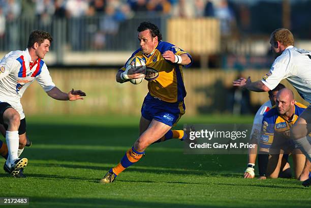 Francis Cummins of Leeds Rhinos makes a break forward during the Tetley's Bitter Super League match between the Wakefield Trinity Wildcats and Leeds...