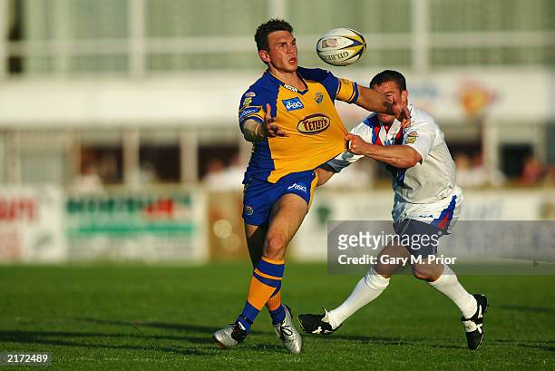 Kevin Sinfield of Leeds Rhinos is tackled by Matt Seers of Wakefield Trinity Wildcats during the Tetley's Bitter Super League match between the...