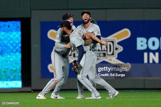 Riley Greene, Parker Meadows and Matt Vierling of the Detroit Tigers celebrate a 7-6 win over the Kansas City Royals at Kauffman Stadium on September...