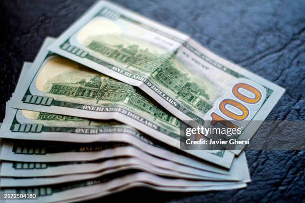 bills of 100 dollars in cash - new york stock exchange stock pictures, royalty-free photos & images