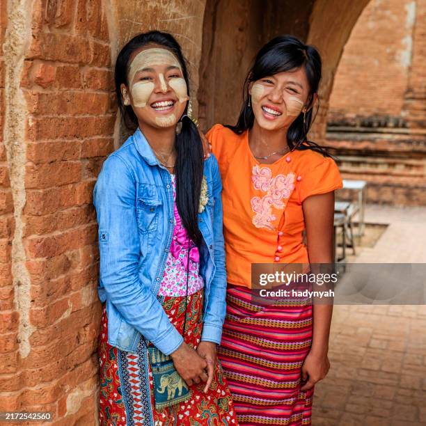 young burmese girls posing in bagan - burmese girl stock pictures, royalty-free photos & images