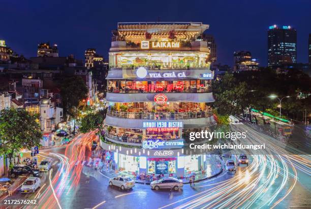 hanoi, vietnam, a bustling intersection in the old quarter - hanoi stock pictures, royalty-free photos & images