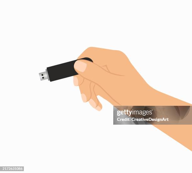 hand holding usb flash drive on white background - usb cable stock illustrations