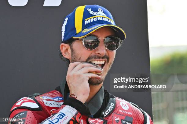 First place Ducati Italian rider Francesco Bagnaia celebrates on the podium after the sprint race of the Emilia-Romagna MotoGP Grand Prix at the...