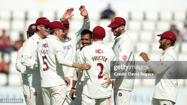 Yuzvendra Chahal of Northamptonshire celebrates with team mates after taking the wicket of Rehan Ahmed during the Vitality County Championship...