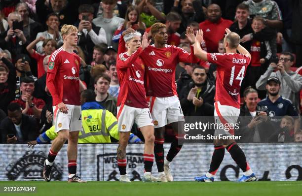 Marcus Rashford of Manchester United celebrates scoring his team's first goal with teammates Alejandro Garnacho and Christian Eriksen during the...