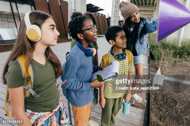 from tablets to laptops: how technology empowers school kids - girl friend galleries stock pictures, royalty-free photos & images